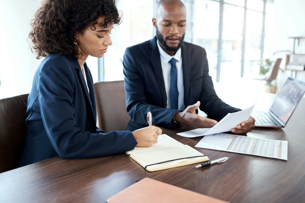 Accounting, paperwork and meeting black people for finance strategy, taxes report or budget review.